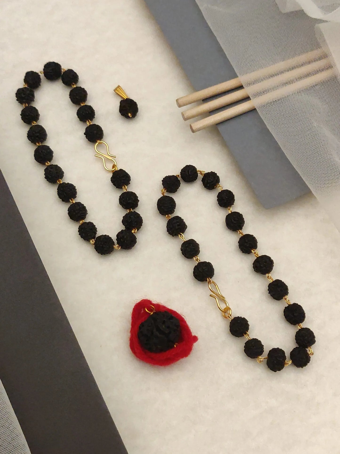 2 black geru color regular rudraksh bracelet + 2 pendents